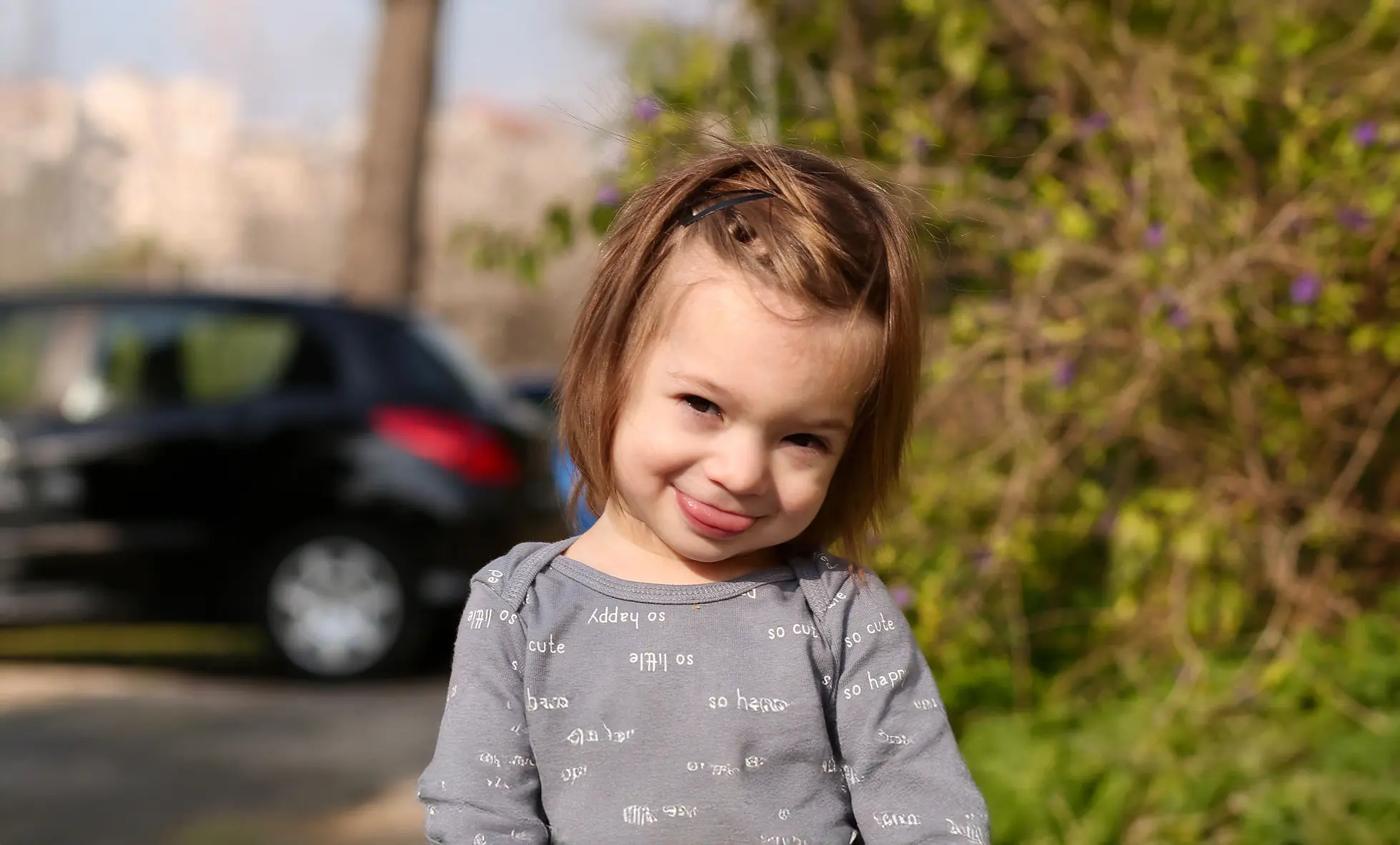 Child smiling outdoors, symbolizing recovery and well-being
